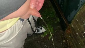 neo pissing outside in the rain