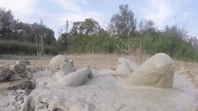 Perverted bloke jumps in mud and poses in front of the camera