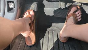 Fifi pedal pumping in well worn Rainbow flip flops