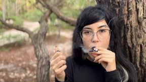 Enjoying two cigarettes at once in the forest