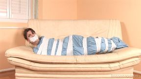 A Blue Bedsheet And White Duct Tape Keeps Petite Indica James Wrapped And Quiet!