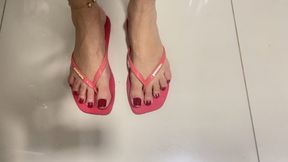 seducing with my beautiful feet in new pairs of flip flops