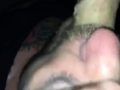 Sucking cum out of a tourist daddy in darkroom
