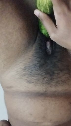 Busty bitch playing with herself and fucking herself with a cucumber