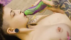 Adorable tiny tattoo girl plays with thick toy and spreads herself