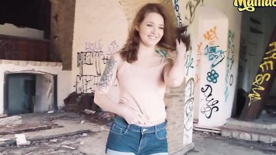 Lustful redhead is getting pussy banged by a tattooed guy in an abandoned building