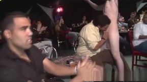 Male stripper with tattoos having fun at a party