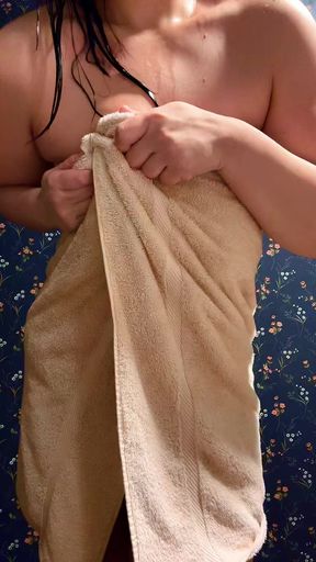 milf dripping wet ready to drop her towel from a long hot shower