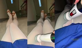 Chinese ladyboy gushes on office stairs white stockings glistening
