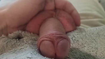 The guy gently and carefully massages his penis