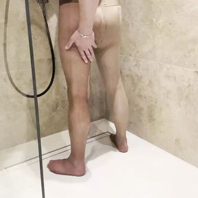 Masturbation with tights in the shower at the hotel