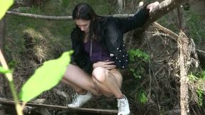 Brunette skinny Russian student girl pisses in the forest