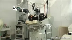 Cruel Nurse humiliates femdom slave with rubber doll and high heels