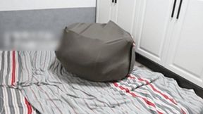 GG54 - A cute girl stuffed herself into a very large sack.