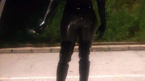 Latex rubberdoll smoking and walking outdoor