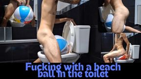 Fucking with a beach ball in the toilet