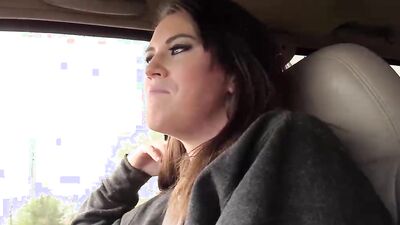 Brunette with big natural tits sucks her driver's cock in the car