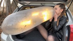 Inflating and bursting a condom and spitting (custom video)