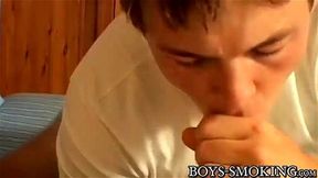 Hairy twink takes a smoke with his big dicked friend in bed