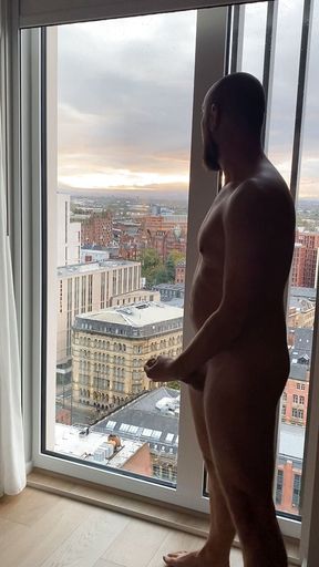 Exhib jerk off and cum over cityscape view.