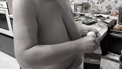 With big natural saggy tits, mature housewife bbw milf cooking in the kitchen.