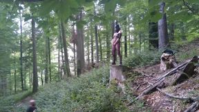 Standing Pissing in a Woods in a Bunny Mask and Fishnet