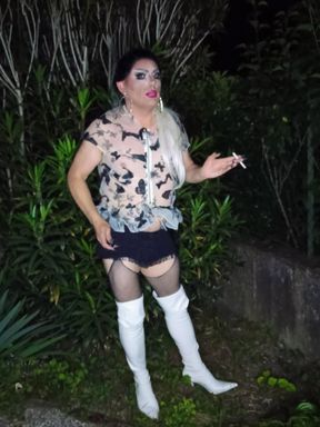 Sexy mature transvestite slut celebrates her birthday in the garden smoking in thigh-high boots
