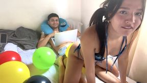 Popping balloons with my butt on his dick