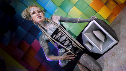 Tattooed Goddess Teases with Tech and Tie