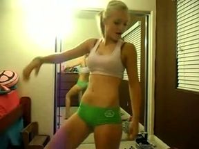 Sporty blonde babe is dancing on webcam also looking at her own reflection in the mirror