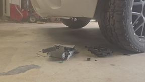 Chrissy destroying her old radio with her truck