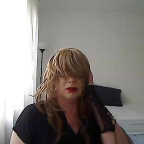 horny MILF tranny in front of the webcam plays with a vibrator simulating Blowjob