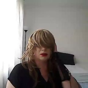 horny MILF tranny in front of the webcam plays with a vibrator simulating Blowjob