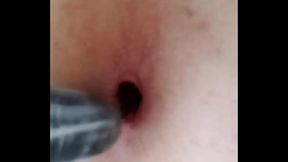 Skinny twink puts condom on cucumber and fills his tight asshole