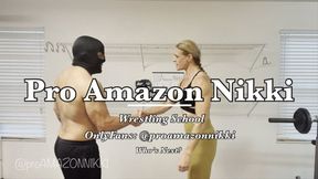 OMG! Powerful Amazon teaches the grapevine and scissors to new wrestling student! Poor fool!