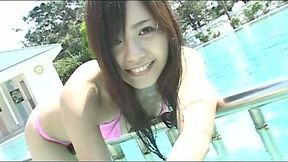 Charming japanese babe Rimi Tachibana bathes in a pool