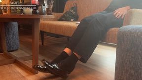 Candid shoeplay waiting for another meeting