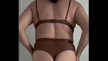 Amateur crossdresser trying on just delivered bodysuit