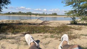 Flaccid penis next to the water