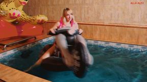 Alla hot backer on a big inflatable motorcycle in the pool brings herself to orgasm!!!