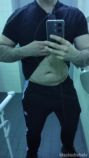 Sexy stud shows off his big soft cock in a public restroom - Part 1