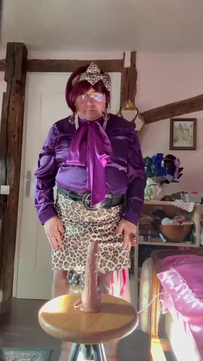 Dressed in a little leopard skirt to suck a dildo