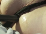 Crossdresser anal vibrator in black thong.