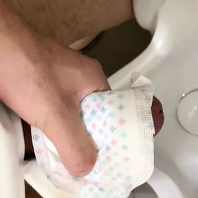 Cumming on the Sanitary pad in public toilet