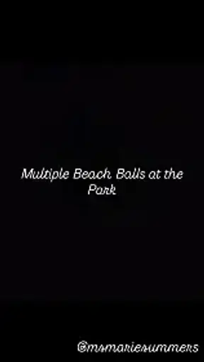 Multiple Beach Balls at the Park