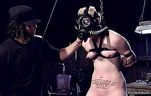 Blonde slave with gas mask tormented
