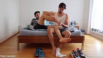 Gay friends playing with feet, socks and shoes