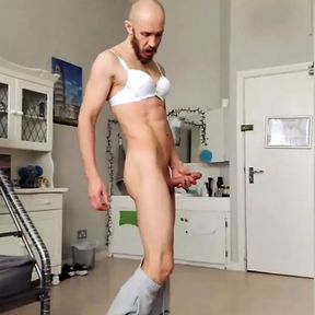 Long-legged man in bra jerks hard dick