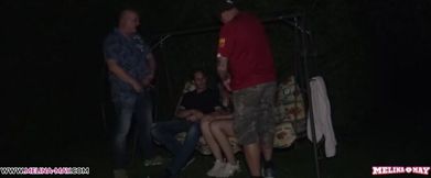 Melina May enjoys a wild outdoor gangbang with her husband watching!