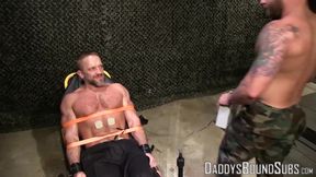 Hot military guy Dirk Caber loves being tied up to a table and tormented
